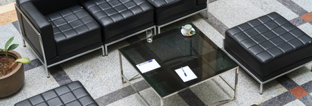 Black leather furniture arranged in a modern wayの写真素材