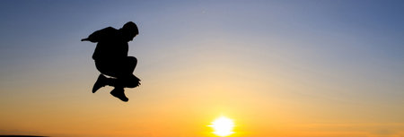 Silhouette of jumping man