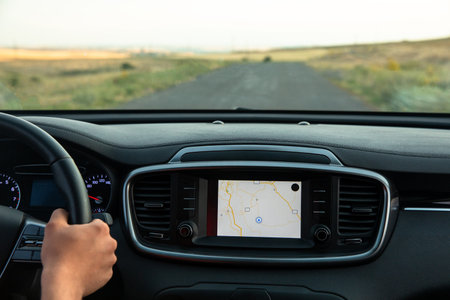 The driver follows the directions of the navigator, photo from inside the car, stock photo