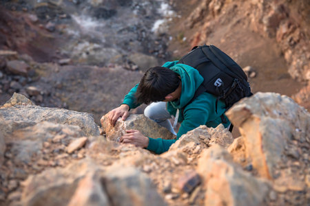 A man climbing a mountain. stock photoの写真素材