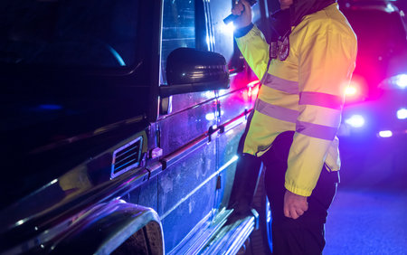 Policeman stopped the car to check, policeman at the car door, stock photoの写真素材