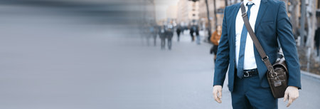 Businessman holding a briefcase on shoulderの写真素材