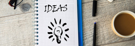 idea text with light bulb on notepad