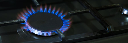 Natural gas burning on kitchen gas stove