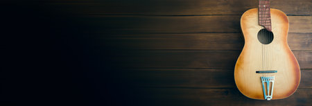 guitar on the wooden table background