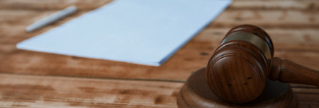 document with wooden judge on tableの写真素材