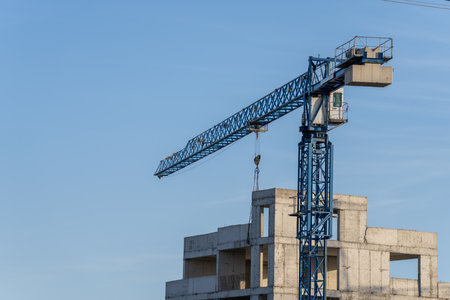 Construction of high-rise buildings, crane next to buildings, construction concept