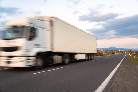 Cargo truck in motion on the road, cargo transportation conceptの写真素材