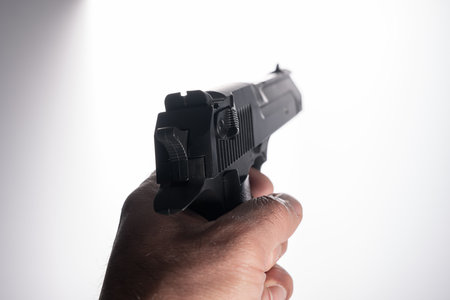 Gun in man's hand, criminal conceptの写真素材