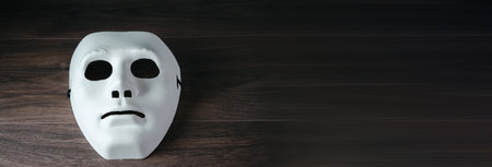 White anonymous mask on the tableの写真素材