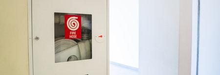 Fire hose on the wall in the building