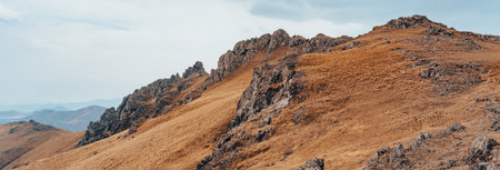 Dry mountain peaks under the cloudsの写真素材