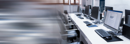 Computers on a table in an empty office