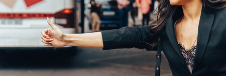A woman stops a vehicle at a bus stop during the day