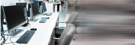 Computers on a table in an empty office