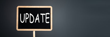 The inscription Update on a blackboard on a gray backgroundの写真素材