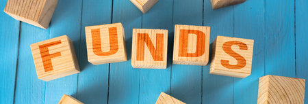 The inscription funds in cubes on the tableの写真素材