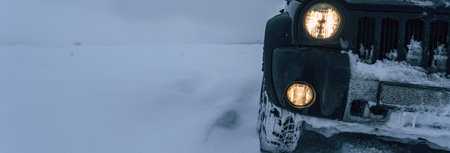 An SUV drifting in a snow fieldの写真素材