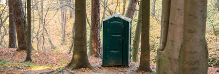 Green toilet cabin in the forestの写真素材