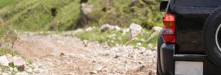 All-terrain vehicle on a rocky, impassable mountain roadの写真素材