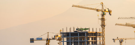 Construction process of high-rise buildings in the cityの写真素材