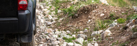 All-terrain vehicle on a rocky, impassable mountain roadの写真素材