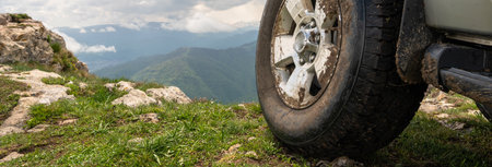 The all-terrain vehicle on top of the mountainの写真素材