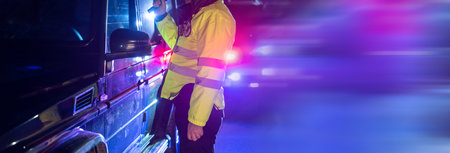 Policeman stopped the car to check, policeman at the car doorの写真素材