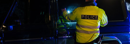 Policeman stopped the car to check, policeman at the car door
