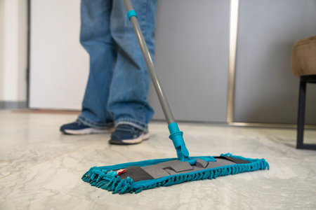 House cleaner mops the floor, cleanliness conceptの写真素材