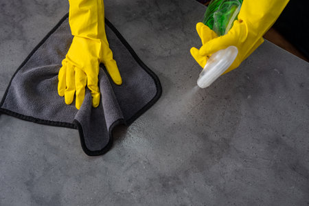 Housewife cleaning the table, cleanliness conceptの写真素材