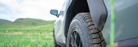 SUV car in green area, travel conceptの写真素材