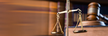 Judge's gavel on book and scales in law office, archives, legal concept