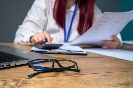 Office Worker Doing Calculations in a Professional Setting