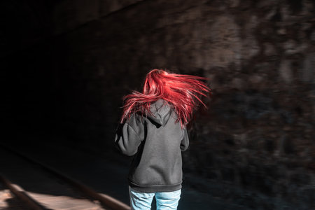 The Girl Escapes from Pursuit Through a Tunnel â Thrilling Escapeの写真素材