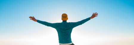 Person with arms outstretched