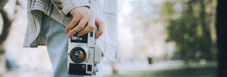 Tourist girl taking pictures of nature with her camera,の写真素材