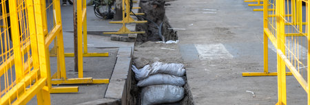 Signs and fences on the street due to road constructionの写真素材