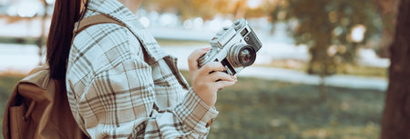 Tourist girl taking pictures of nature with her camera,