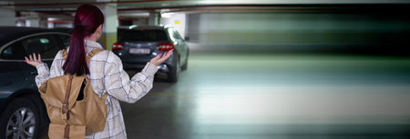 Surprised woman with a backpack in the basement parking lot, her car was stolen