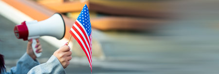 Woman holding a loudspeaker and a US flag, protest, statement