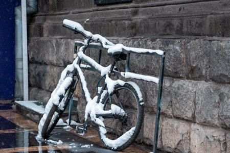 Snow-covered bicycleの写真素材
