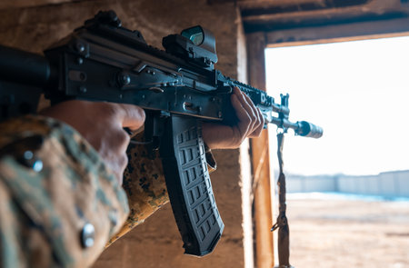 Mercenary Holds Gun, Prepared for Questioning