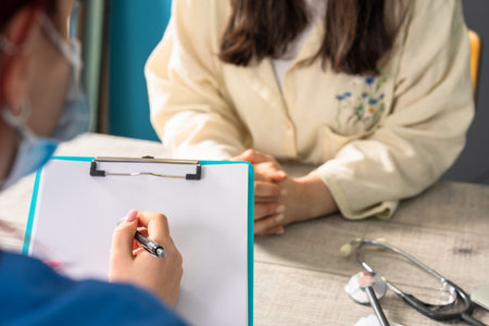 Doctor Prescribing Medication to a Patientの写真素材