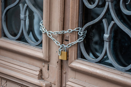 Door Locked with Iron Chain and Padlock