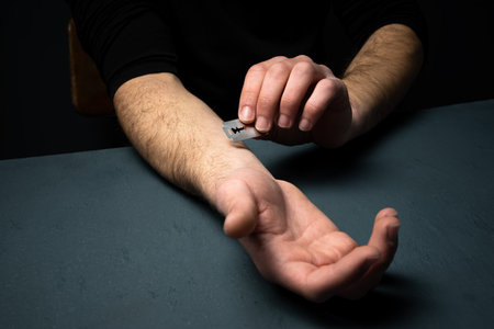 Young Man with Razor, Depression Awarenessの写真素材