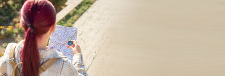Tourist with compass and map in the city