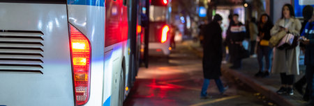 People waiting for the bus at the bus stop in winter,