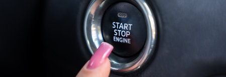 The female driver is trying to start the car's engine.の写真素材