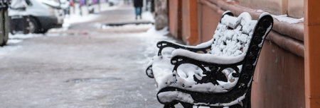 Wooden Benches Completely Covered in Snowの写真素材